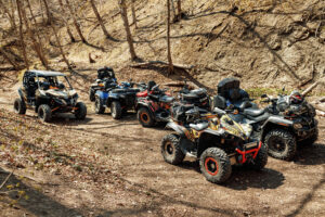 Group of parked ATVs on a forest trail near Zion National Park before an off-road tour